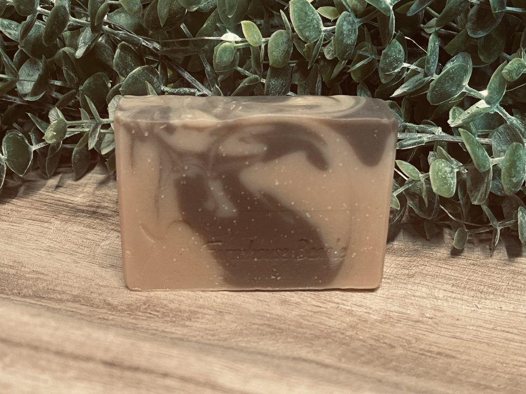 Farmhouse-Beagle-Soap-Company-Rustic-Cabin- Tallow Soap with green plant background